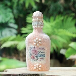 Decorative Pink Bottle with Floral Design